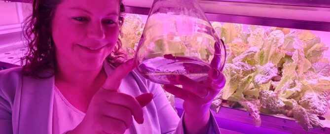 Women in a laboratory viewing plant