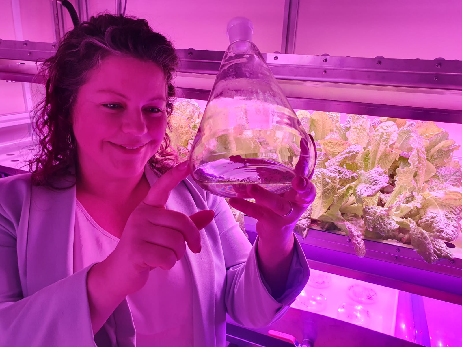 Women in a laboratory viewing plant